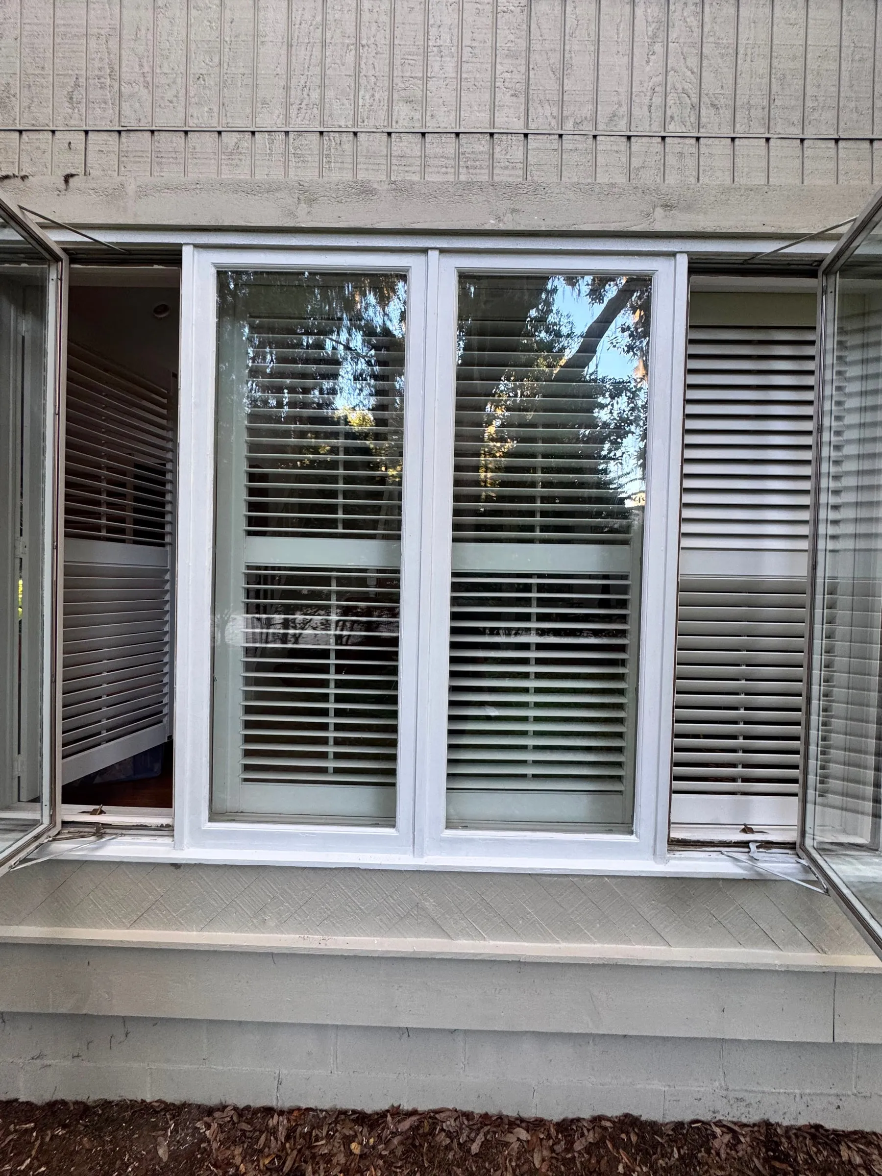 A run of casement windows in new frames and trim.